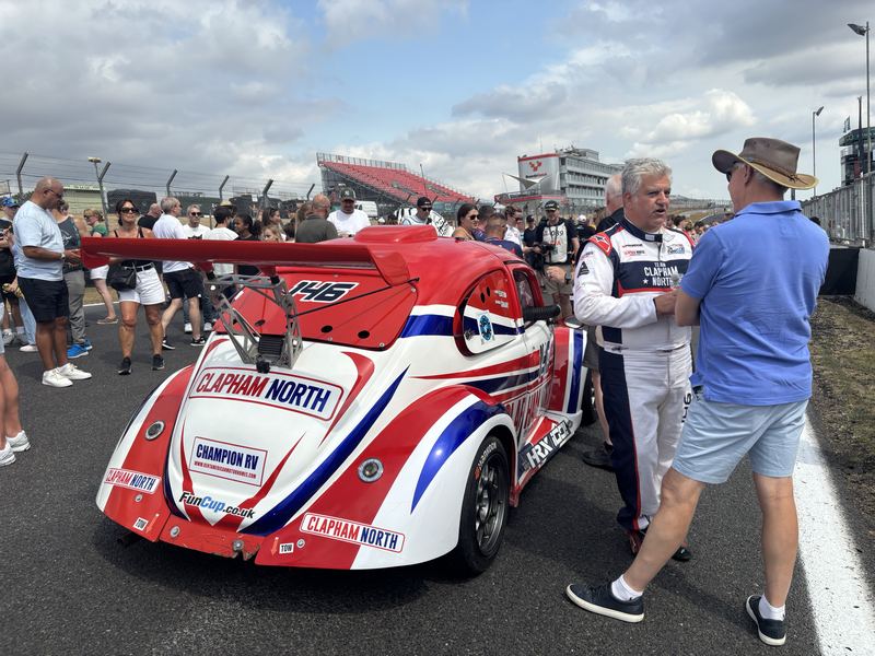 Rear view of Car 146 on the grid with George Grant and a guest