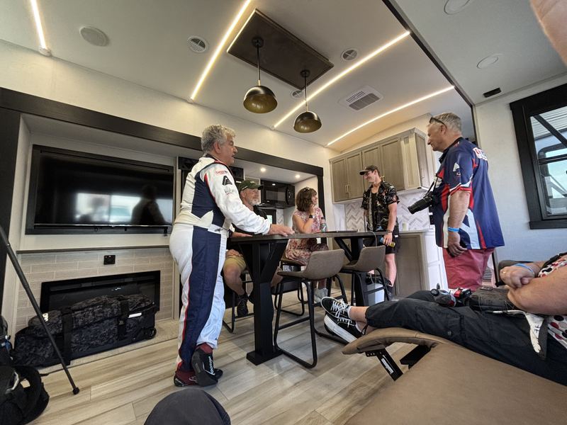 Guests and drivers relaxing in the team motorhome